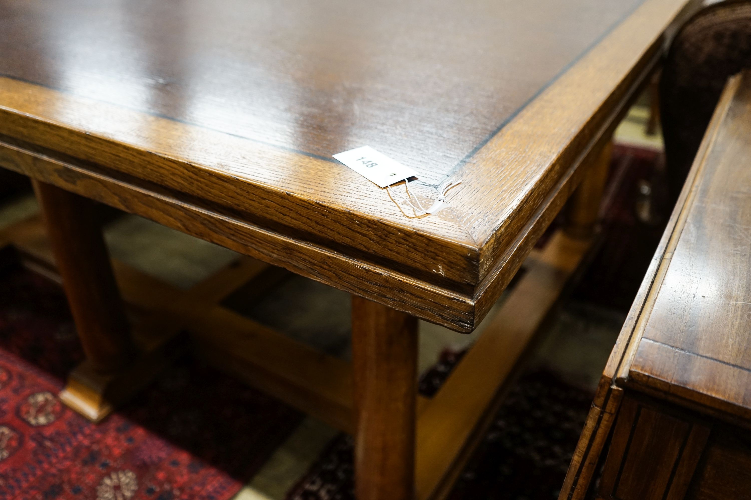 A large rectangular oak dining or boardroom table on six column supports (From The Wills Cigarette Factory, Newcastle), length 182cm, depth 152cm, height 77cm